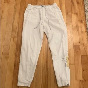 Women’s White Nike Sweatpants with Silver and Gold Logo
